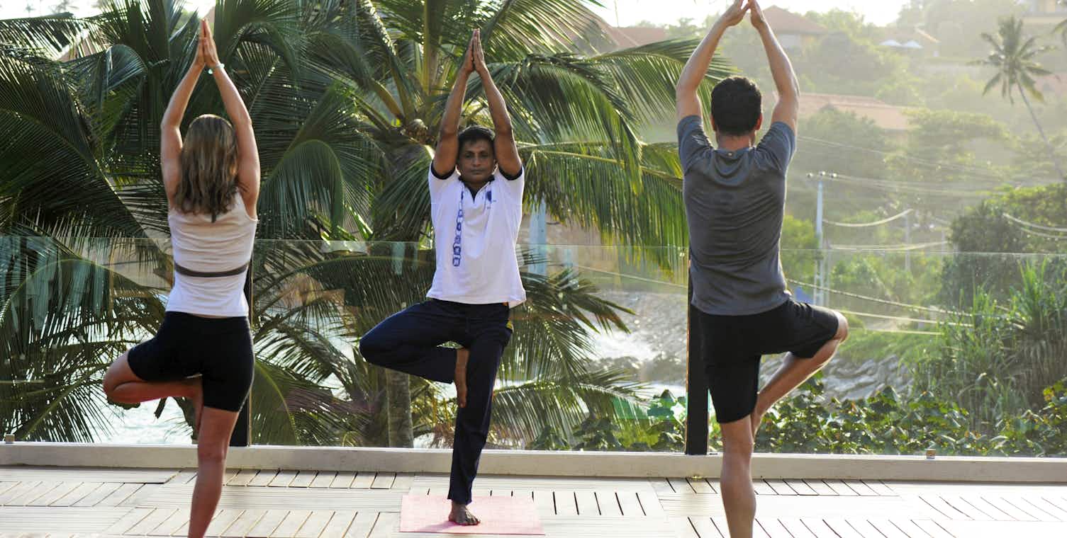 People doing yoga at Thema Hotels and Resorts