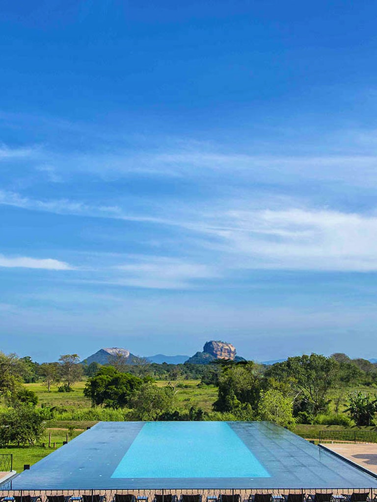 Poolside view of Sigiriya at Aliya Resort