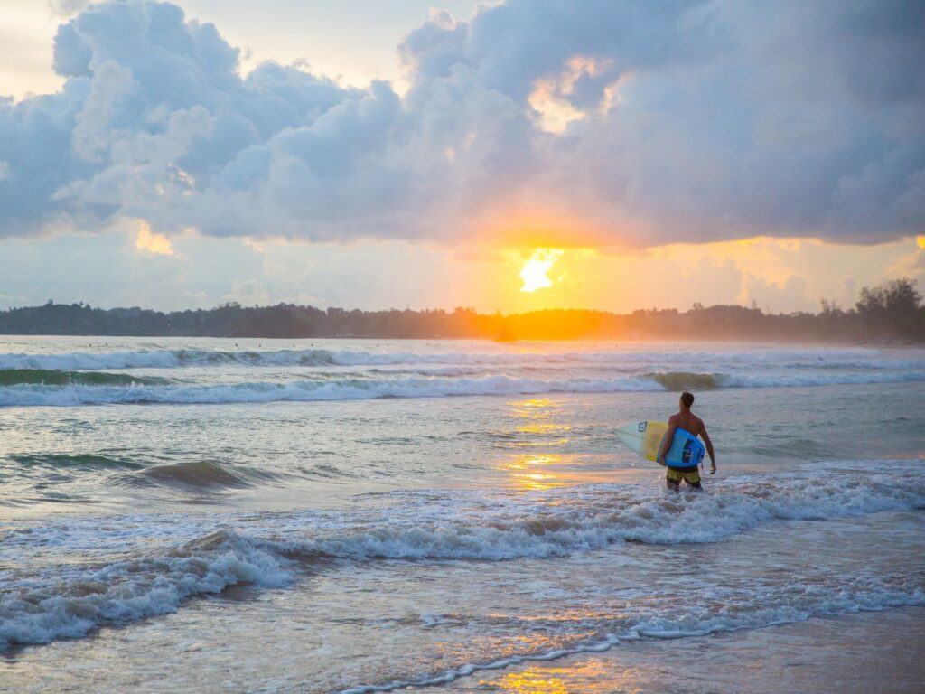 Surfing in Sri Lanka at Sunset near Weligama Bay
